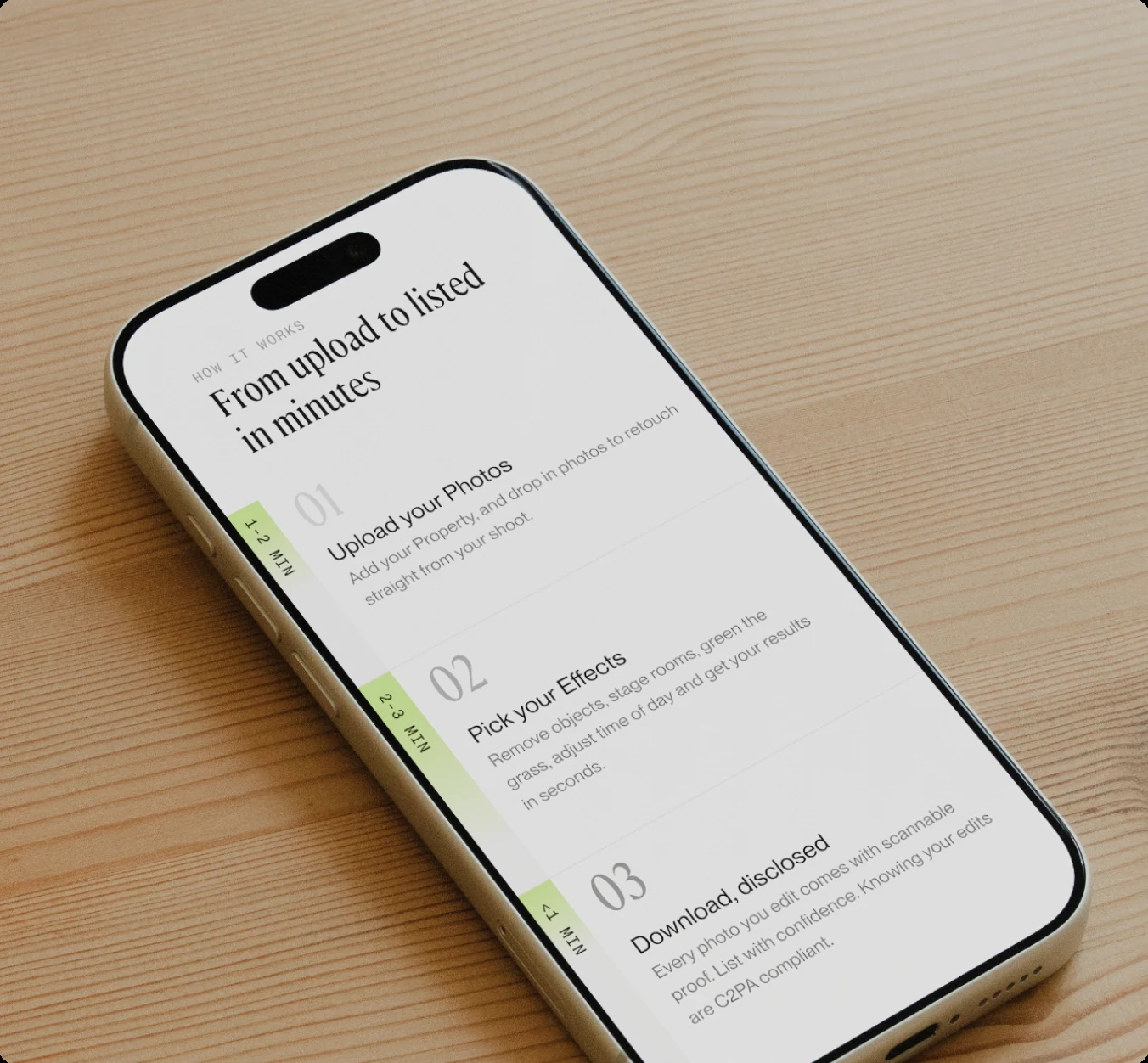 iPhone on a wooden desk showing PropMedia’s “From upload to listed in minutes” steps
